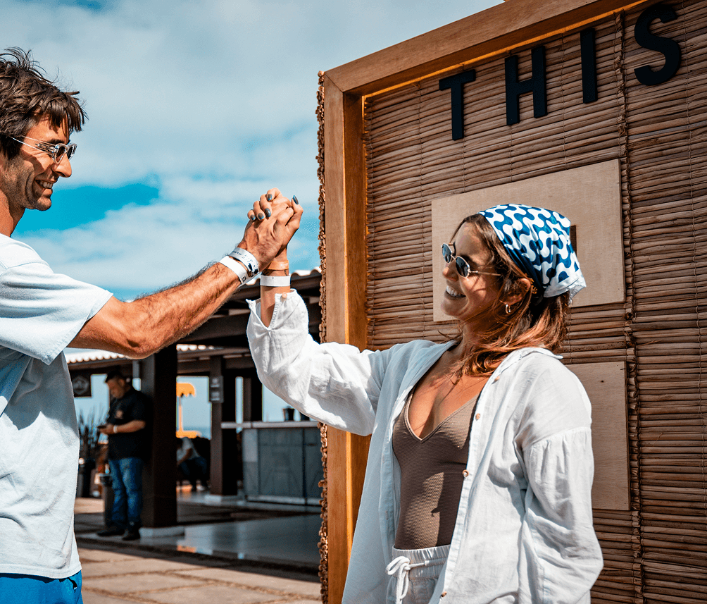 People laughing and holding hands